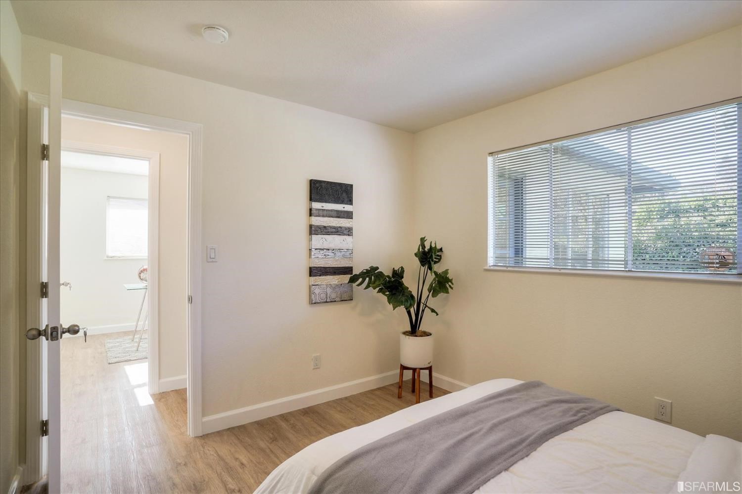 3419 May Road Richmond, CA 94803 - Photo 25 of 38 a bedroom with a bed and a potted plant next to a window