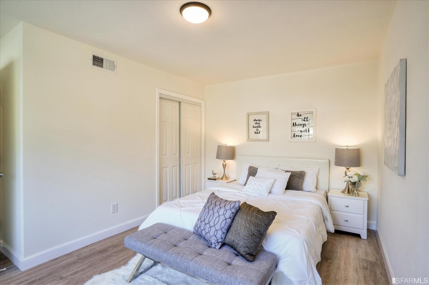 3419 May Road Richmond, CA 94803 - Photo 26 of 38 a bedroom with a bed and a lamp