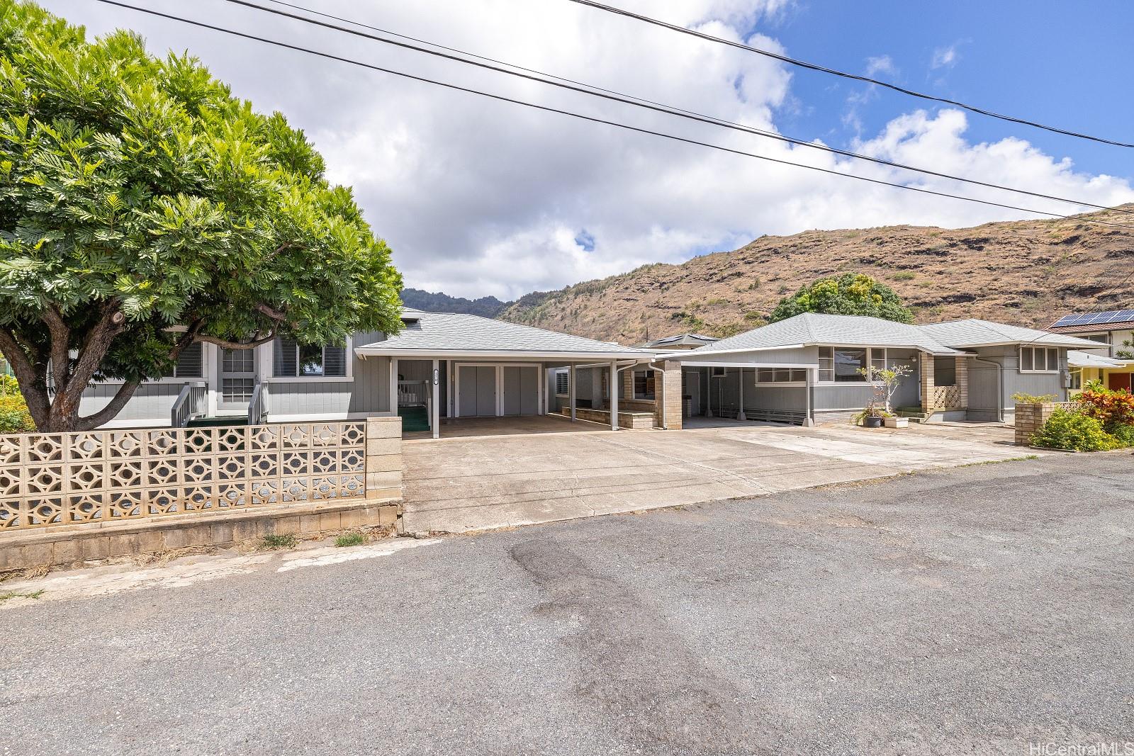 370 Elelupe Road Honolulu, HI 96821 - Photo 1 of 1 a front view of a house with a garden