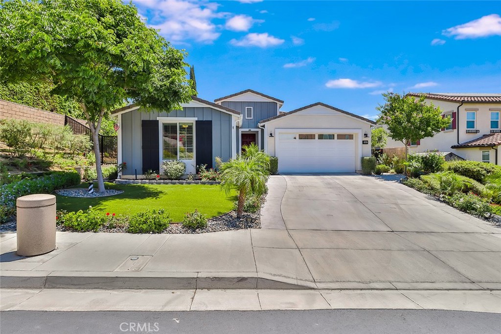 3458 Sugar Grove Court Simi Valley, CA 93063 - Photo 1 of 1 a front view of a house with a yard and potted plants