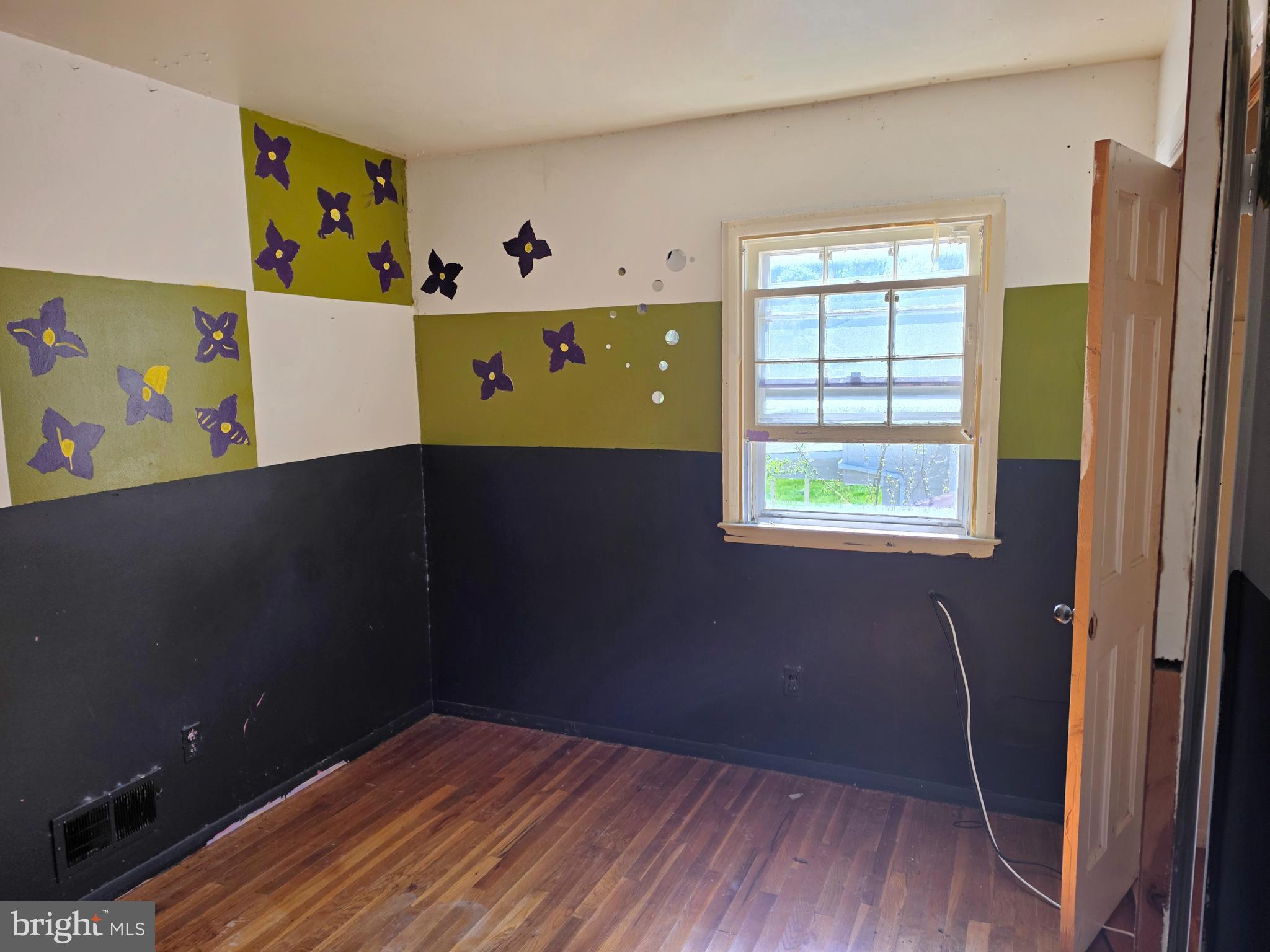 109 Cherry Valley Road Reisterstown, MD 21136 - Photo 14 of 23 wooden floor in an empty room with a window