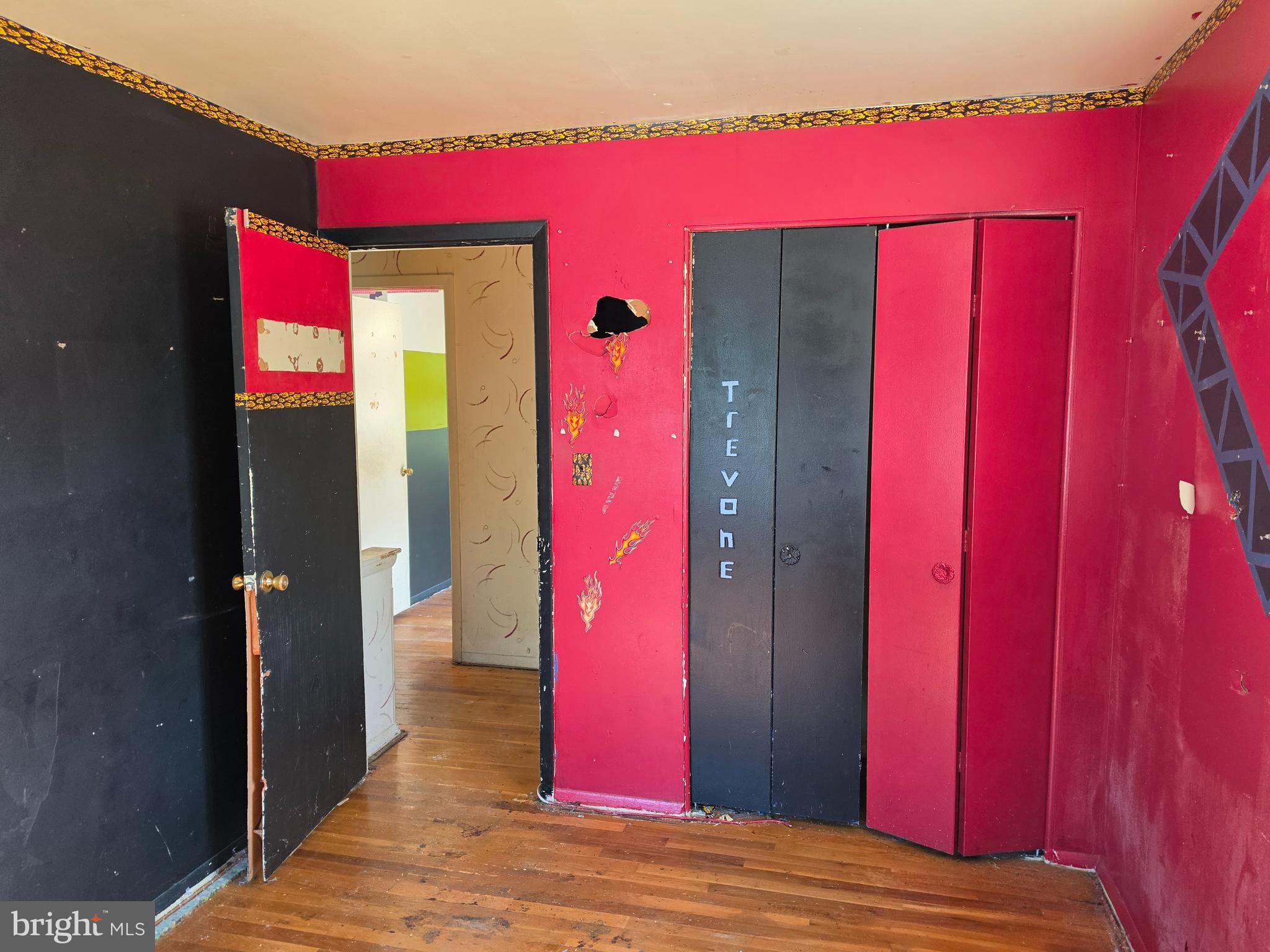 109 Cherry Valley Road Reisterstown, MD 21136 - Photo 16 of 23 a view of a balcony with a red door and wooden floor