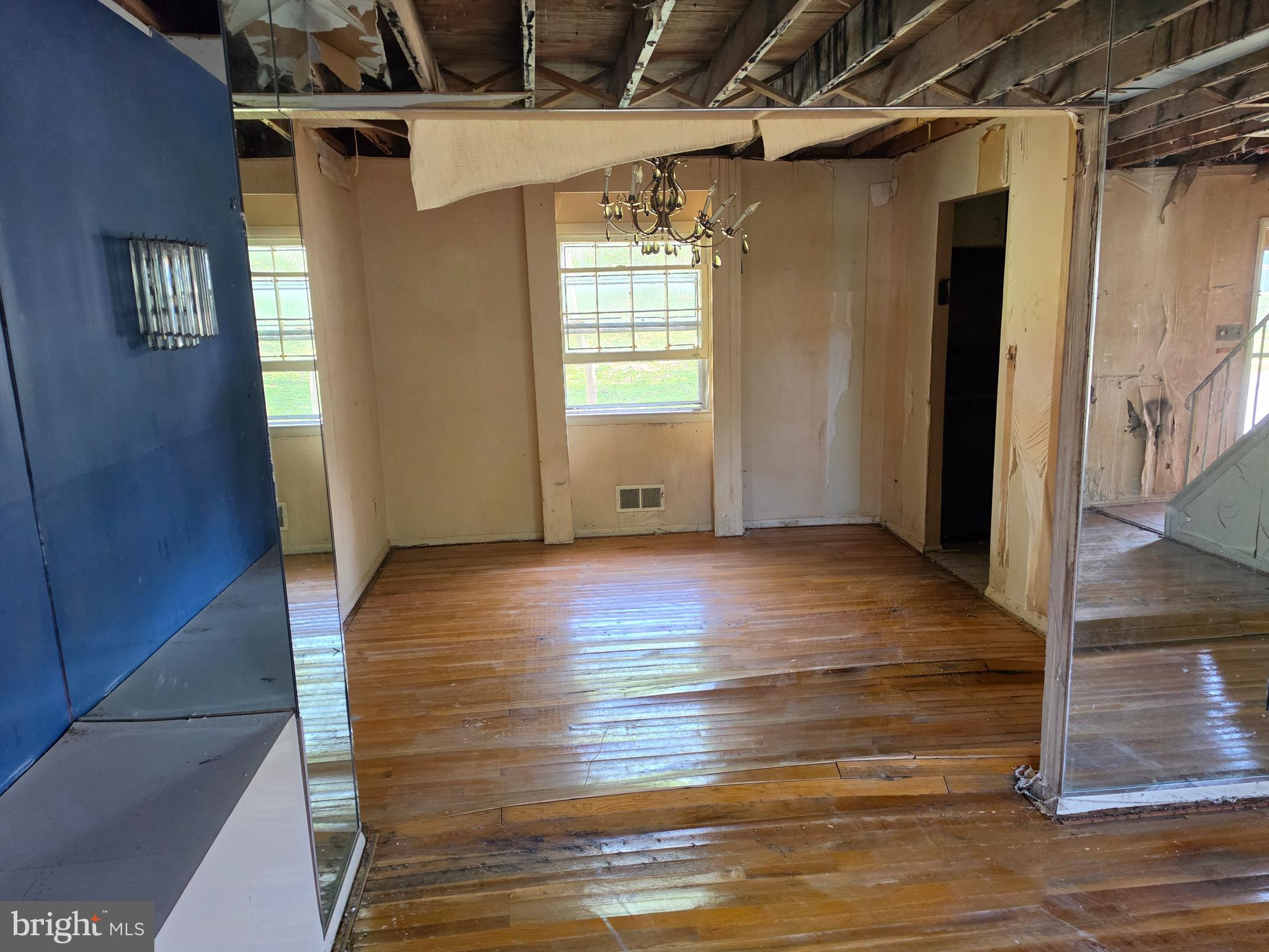 109 Cherry Valley Road Reisterstown, MD 21136 - Photo 4 of 23 a view of empty room with wooden floor and fan