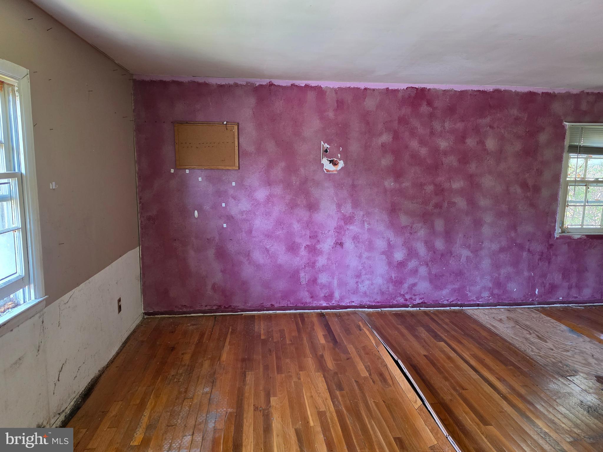 109 Cherry Valley Road Reisterstown, MD 21136 - Photo 10 of 23 a view of a room with wooden floor and window