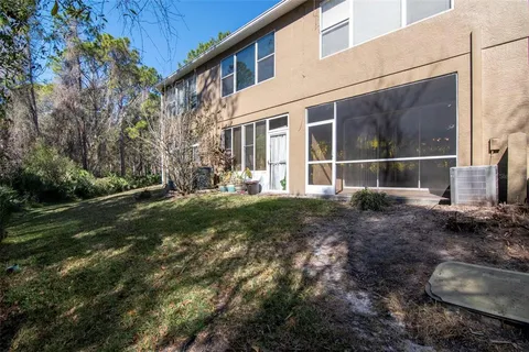 a backyard of a house with outdoor seating