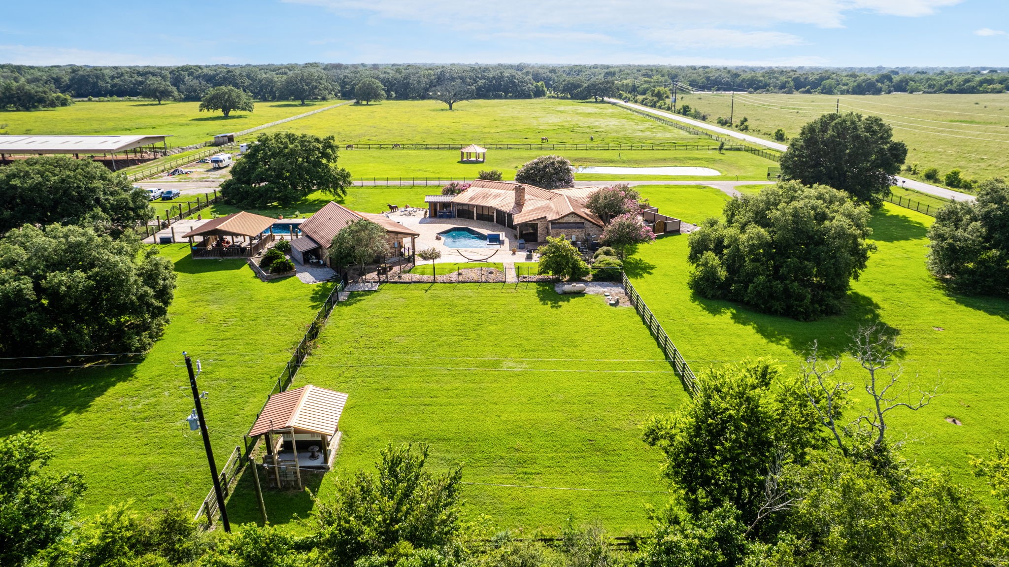 1226 County Road 45 Angleton, TX 77515 - Photo 14 of 30 a view of a swimming pool with a table and chairs