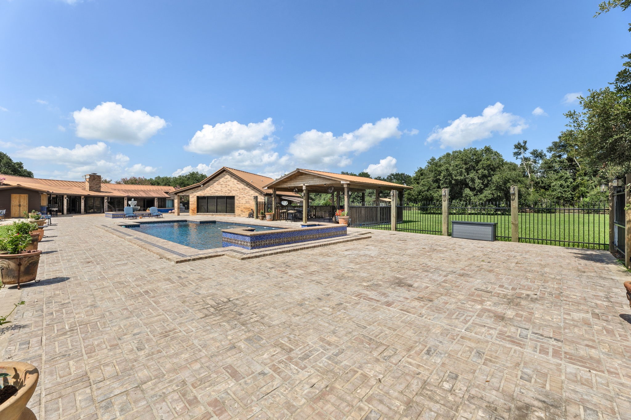1226 County Road 45 Angleton, TX 77515 - Photo 16 of 30 a view of house with yard and entertaining space