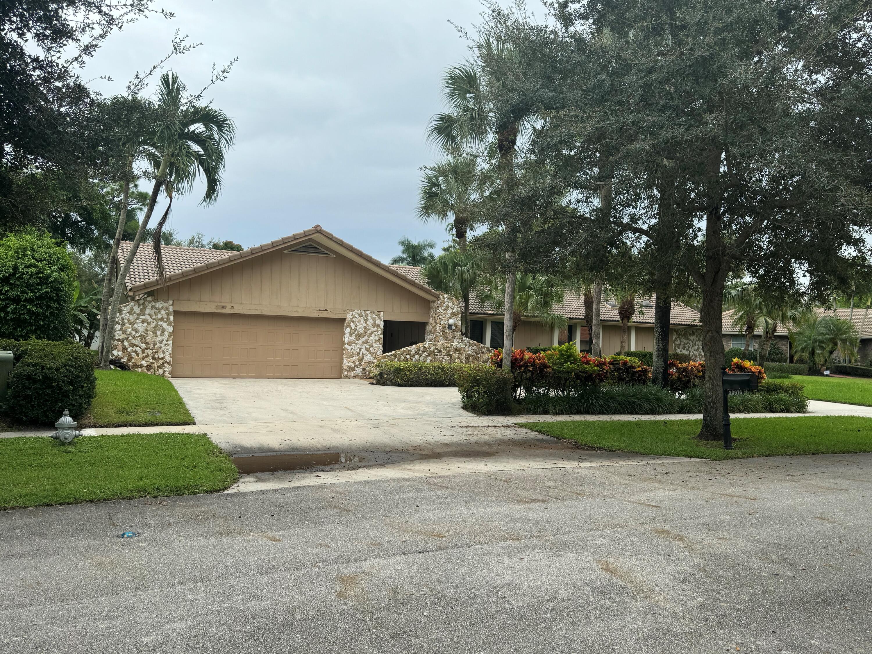 20976 Cipres Way Boca Raton, FL 33433 - Photo 1 of 1 a front view of house with yard and green space