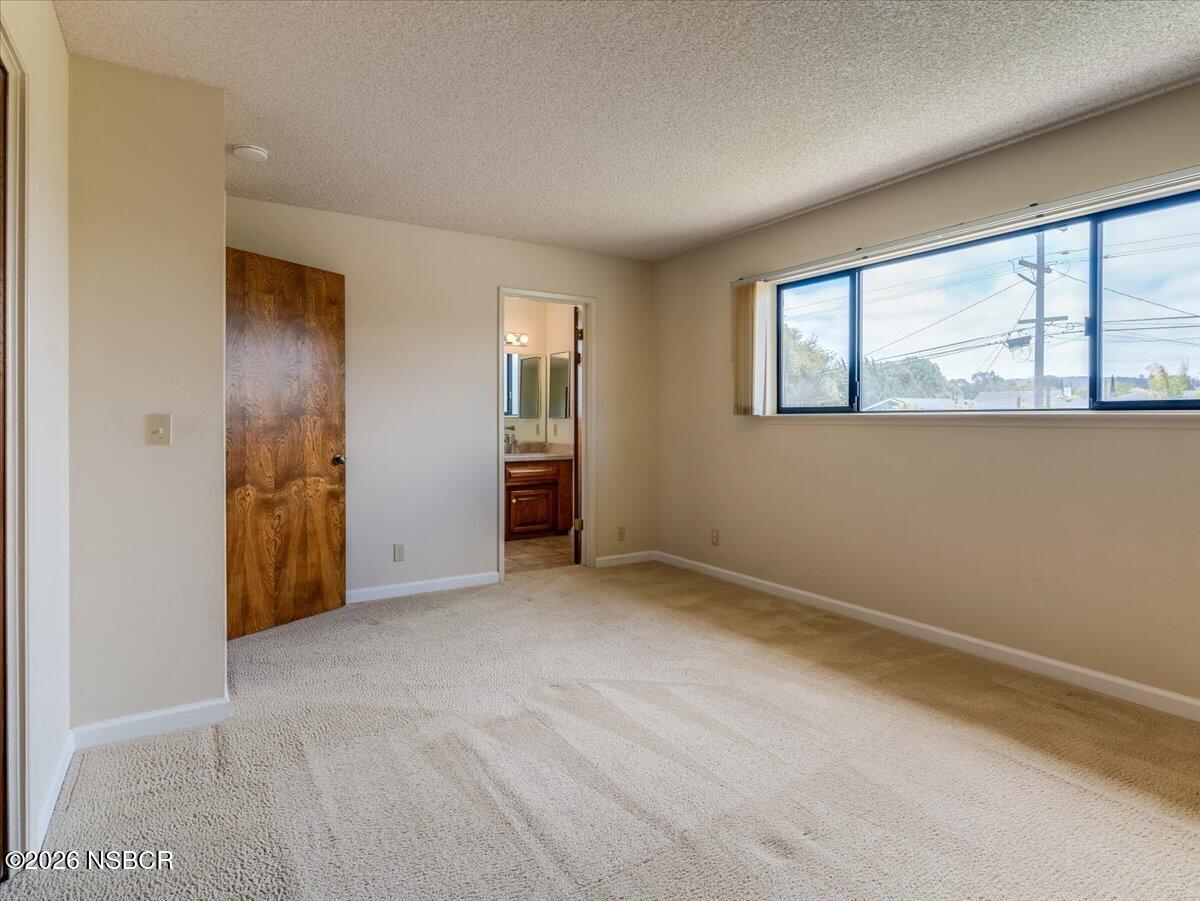 360 Tallyho Road Santa Maria, CA 93455 - Photo 42 of 72 an empty room with windows and closet
