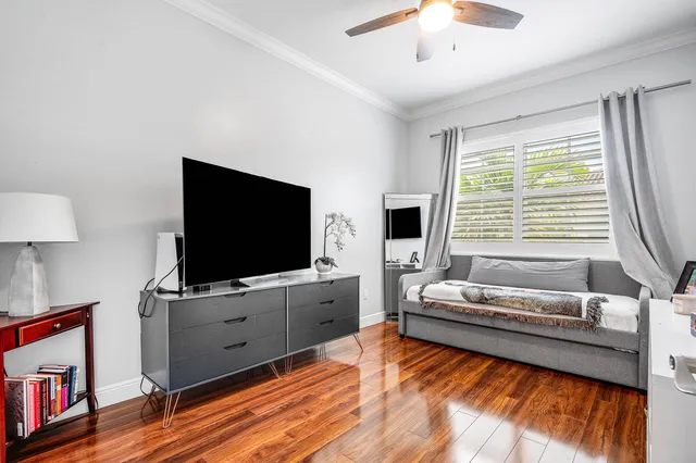 a bedroom with furniture and a window