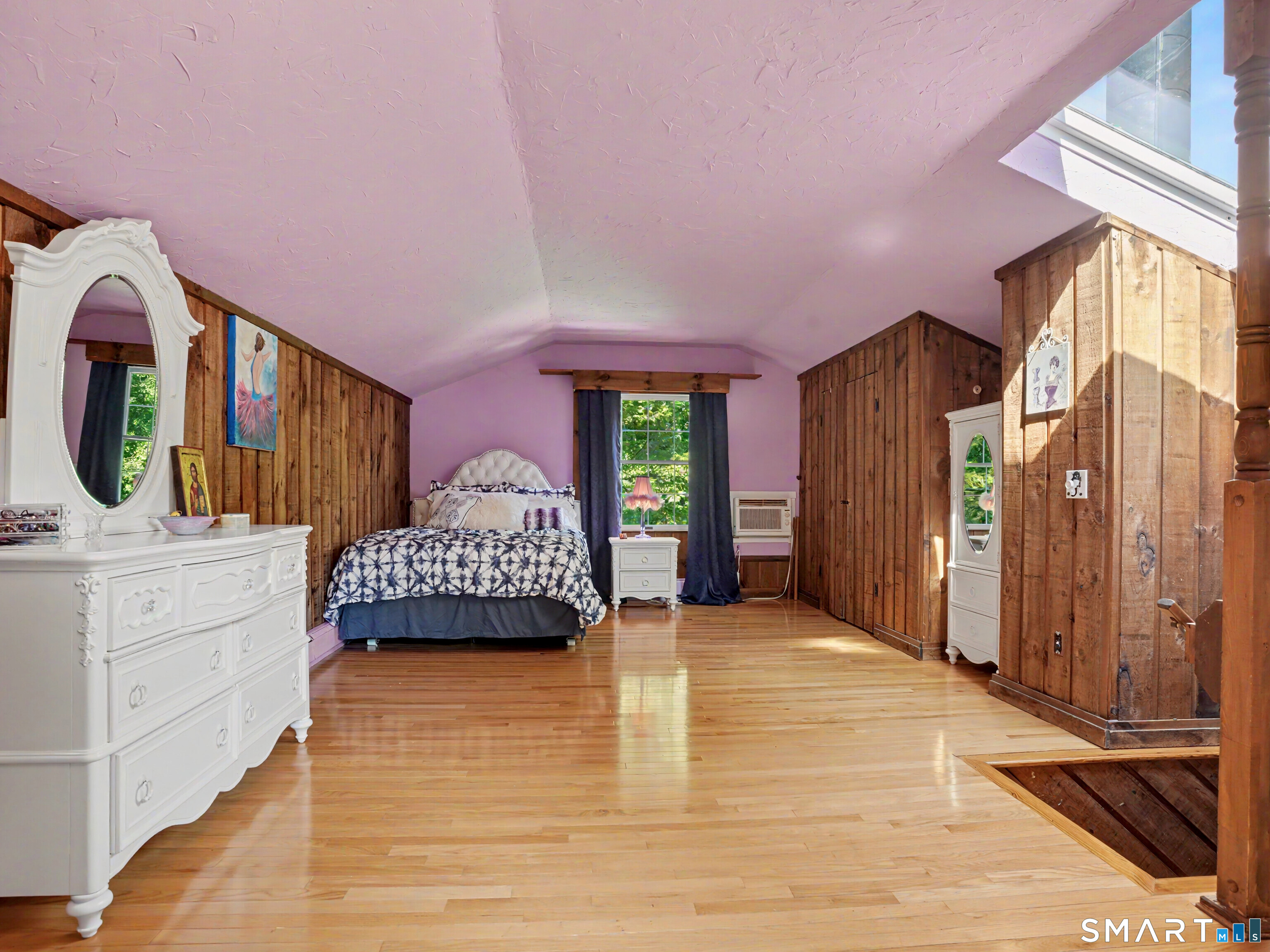 15 Flat Rock Drive Ridgefield, CT 06877 - Photo 28 of 39 a spacious bedroom with a bed a mirror and dresser