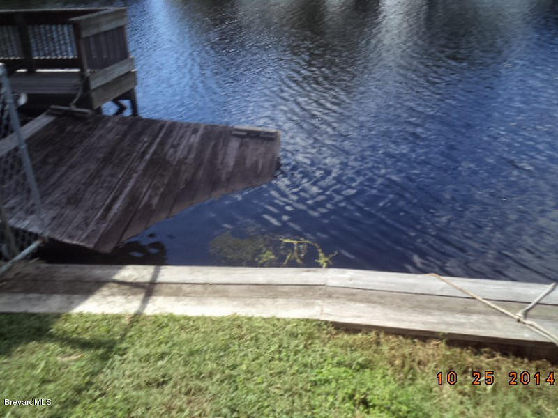 841 Egret Road Cocoa, FL 32926 - Photo 6 of 31 841 dock damage next door