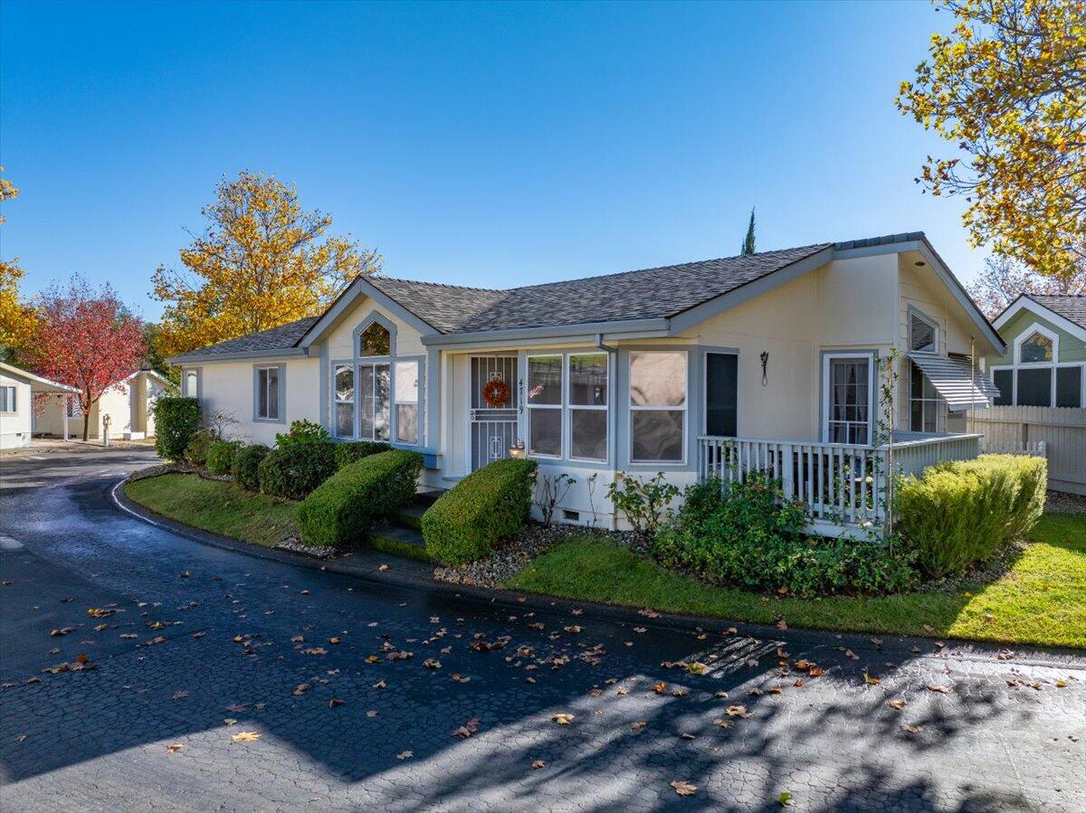 a front view of a house with garden