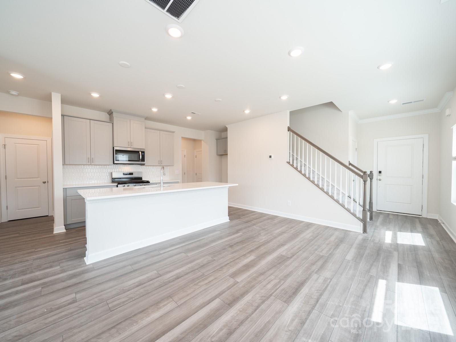 1441 31st Street Northeast Conover, NC 28613 - Photo 7 of 20 a view of kitchen with wooden floor and electronic appliances