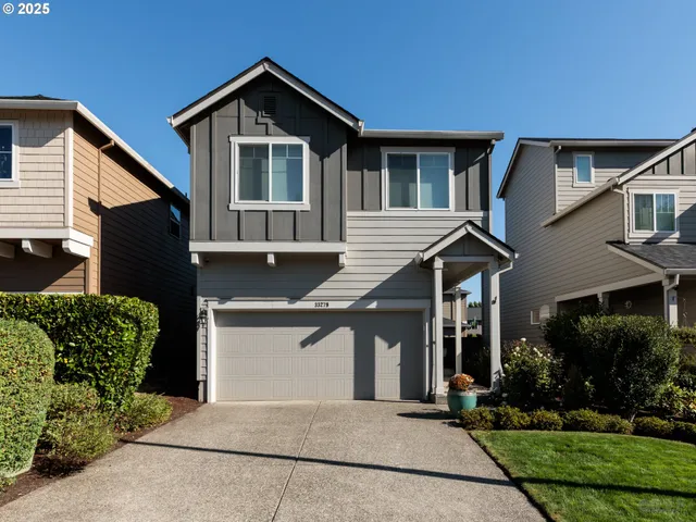a front view of a house with garage