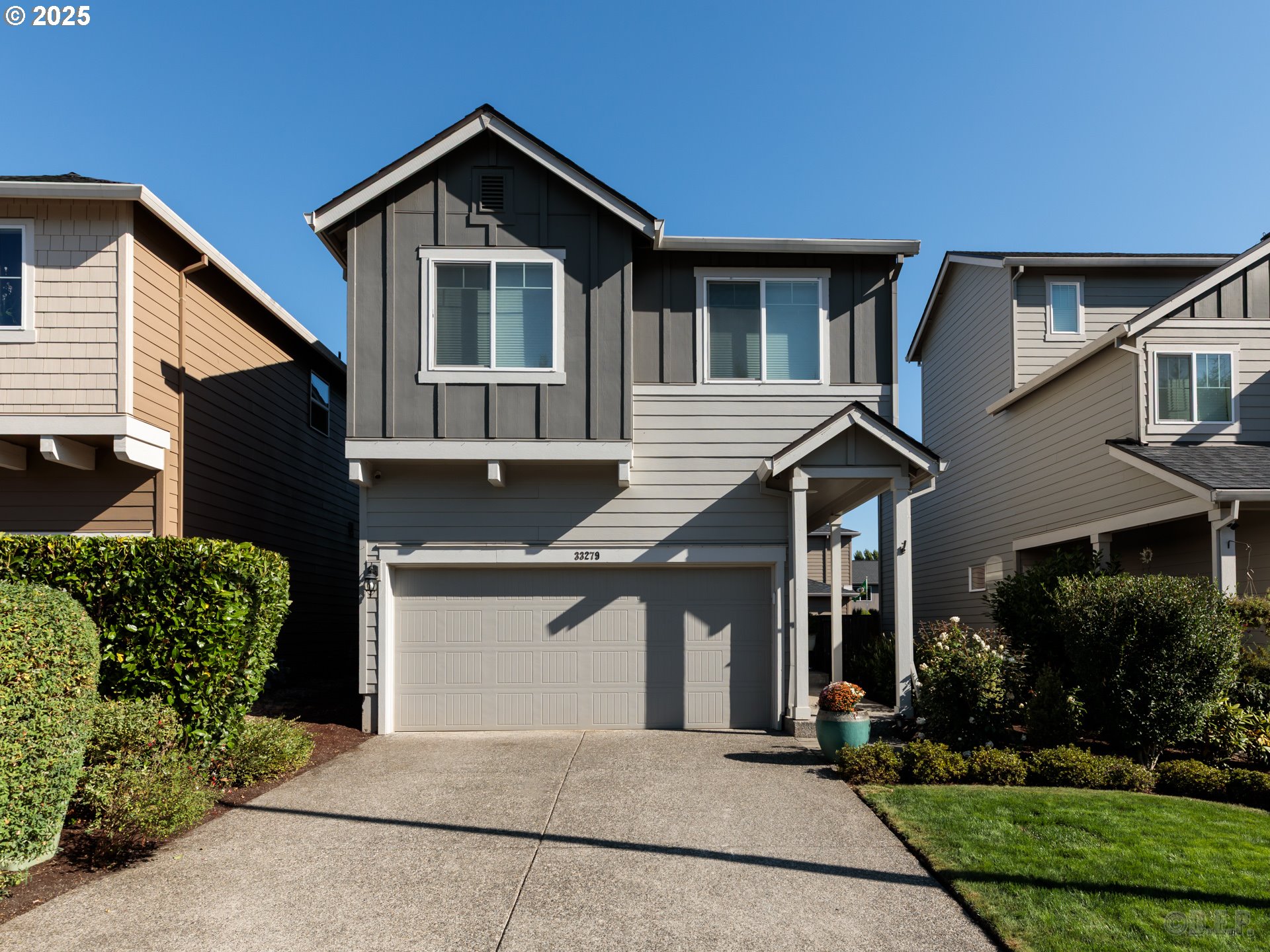 a front view of a house with garage
