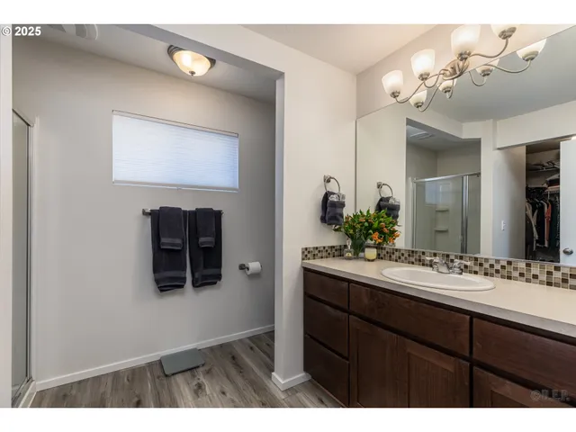 a bathroom with a sink vanity and mirror