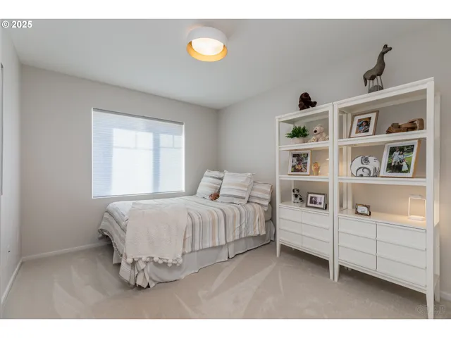 a bedroom with a bed and a book shelf