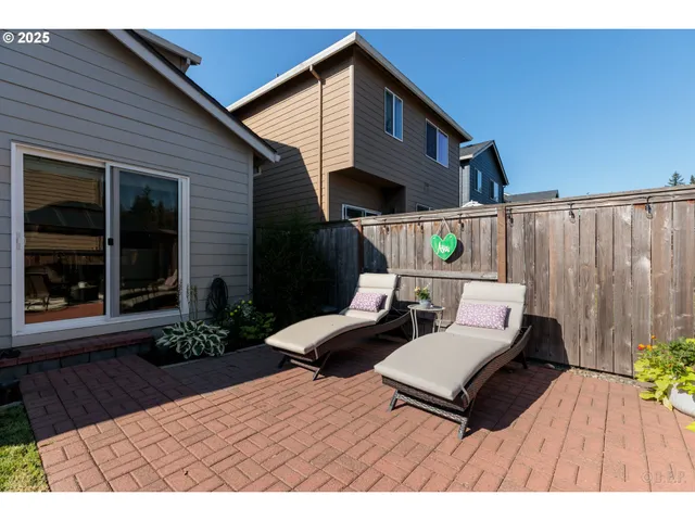 a wooden bench sitting in front of a house