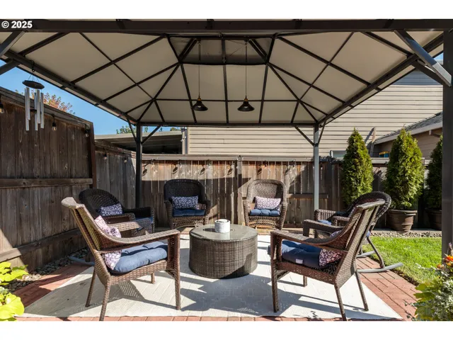 a patio with a patio table and chairs