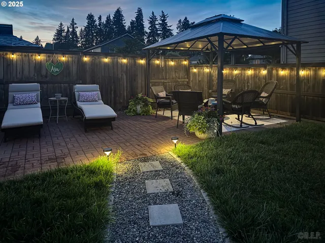 a view of a chairs and table in patio