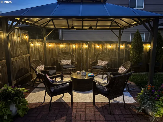 a patio with table and chairs