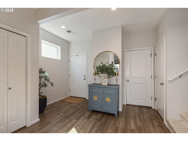 a living room with a furniture and a potted plant