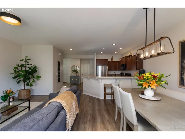 a outdoor dining space with furniture and a potted plant