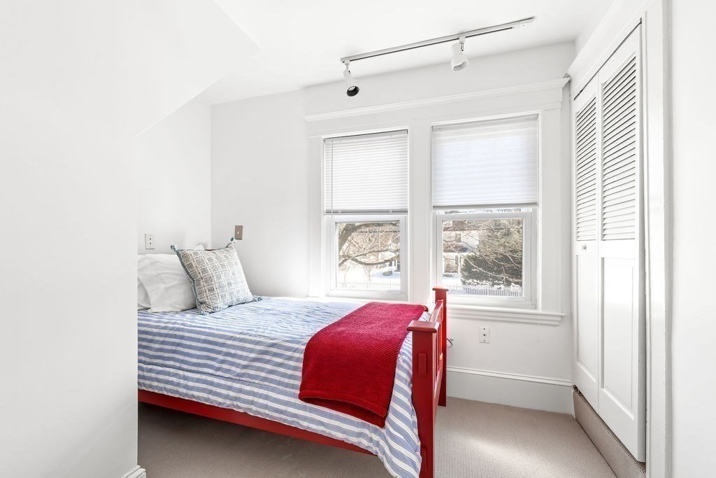 60 High Street Needham, MA 02494 - Photo 21 of 32 a bedroom with a large bed and a window