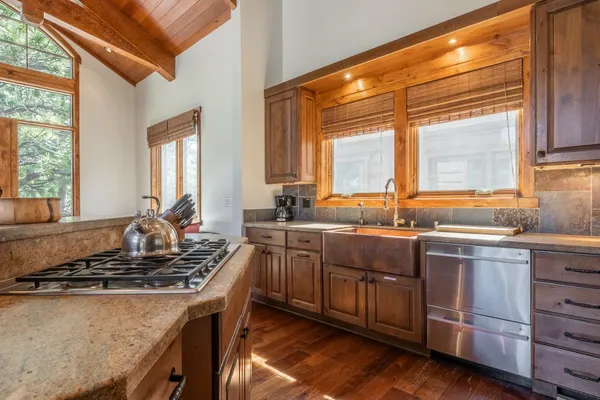 a kitchen with a stove and a sink