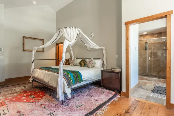 a bedroom with bed and window