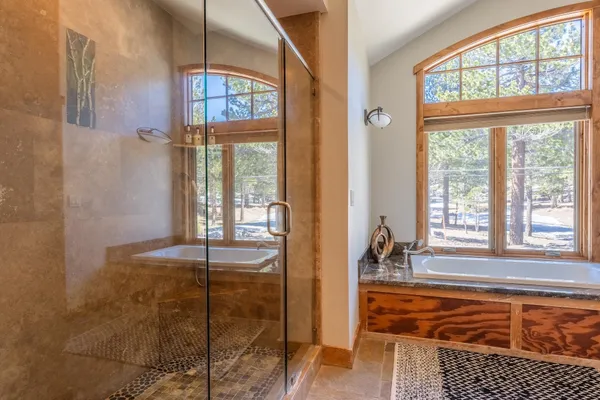 a view of a room that has a bed and a window