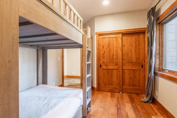a bedroom with a bed and a view of bathroom