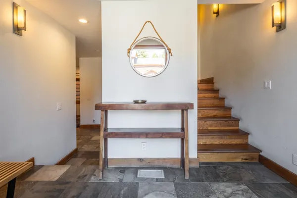 a bathroom with a sink vanity mirror and toilet
