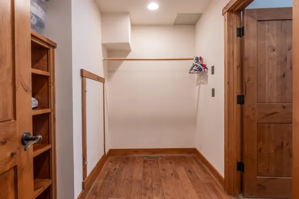 a bedroom with a bed and cabinet