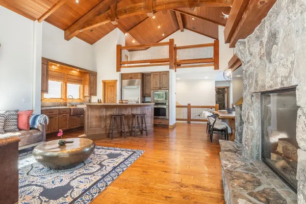 a living room with lots of furniture and a rug