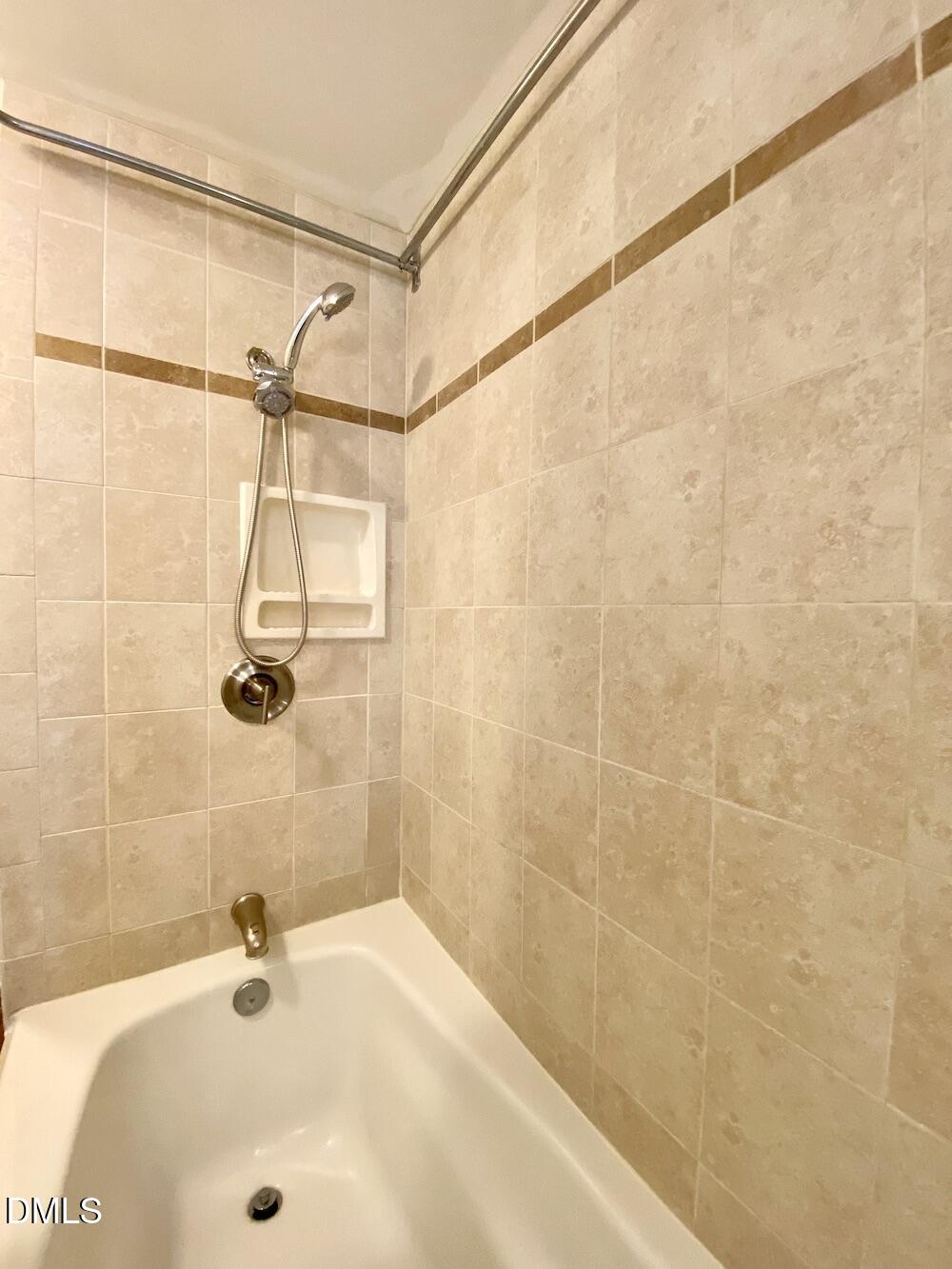 2608 Erwin Road, Unit 428 Durham, NC 27705 - Photo 21 of 33 a bathroom with a sink and shower