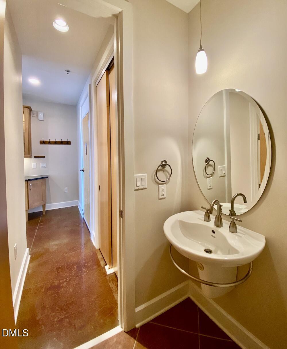 2608 Erwin Road, Unit 428 Durham, NC 27705 - Photo 10 of 33 a bathroom with a sink and a mirror