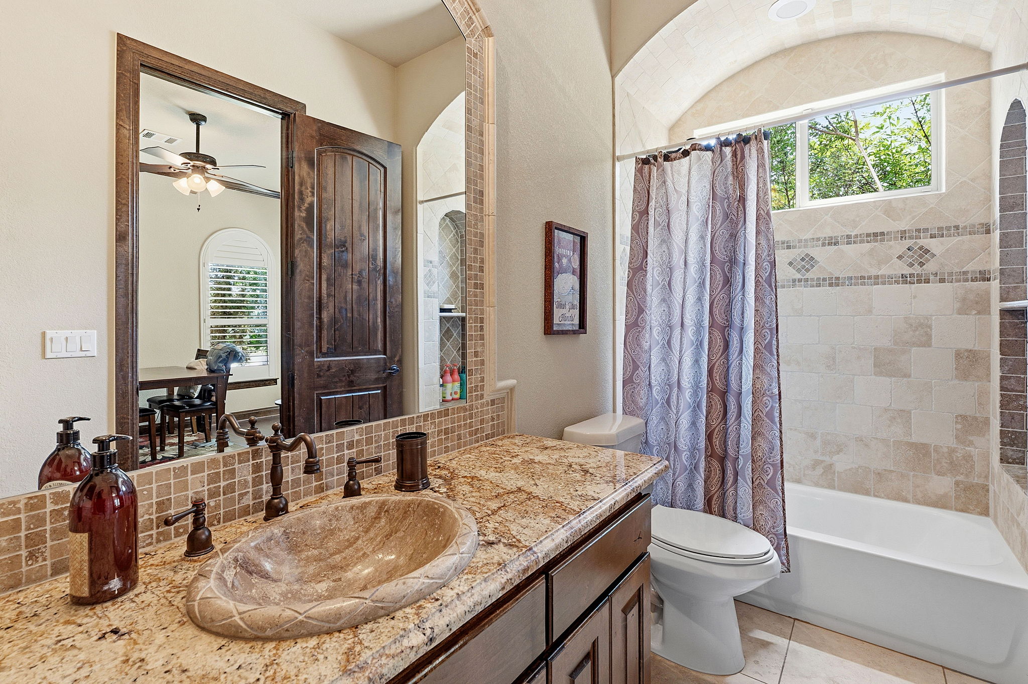 816 Brave Face Street Leander, TX 78641 - Photo 24 of 40 Marble vanity with a vessel sink and bronze fixtures elevate this bathroom's appeal.