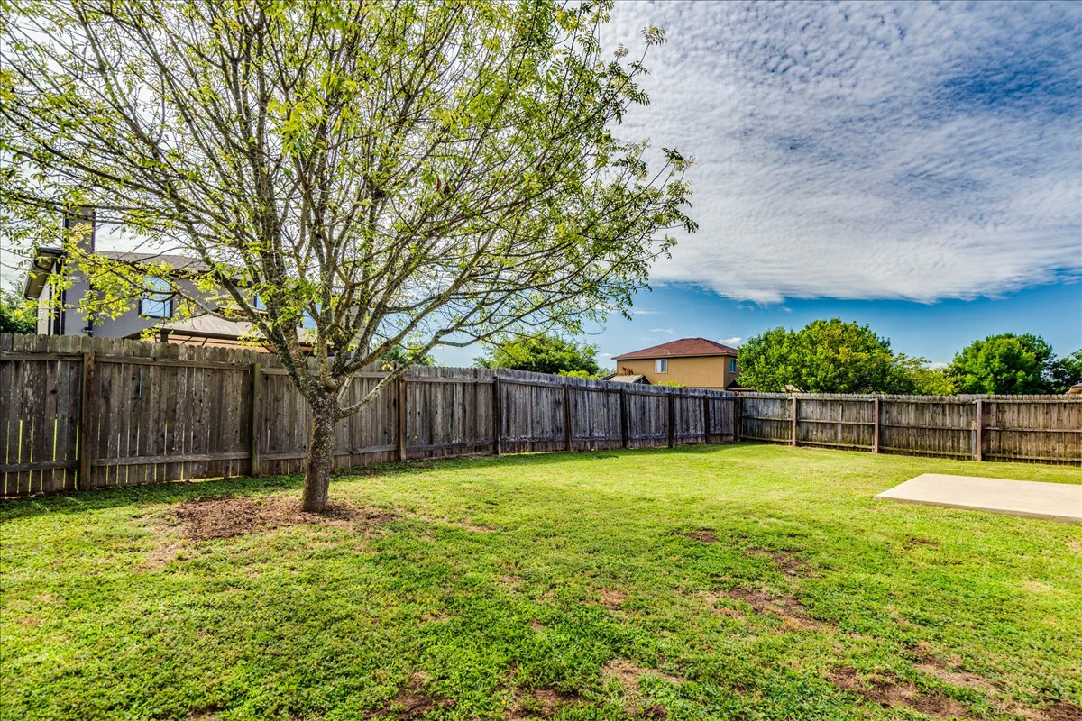 100 Easy Street Hutto, TX 78634 - Photo 27 of 36 A spacious, enclosed yard provides ample room for outdoor activities and private enjoyment.
