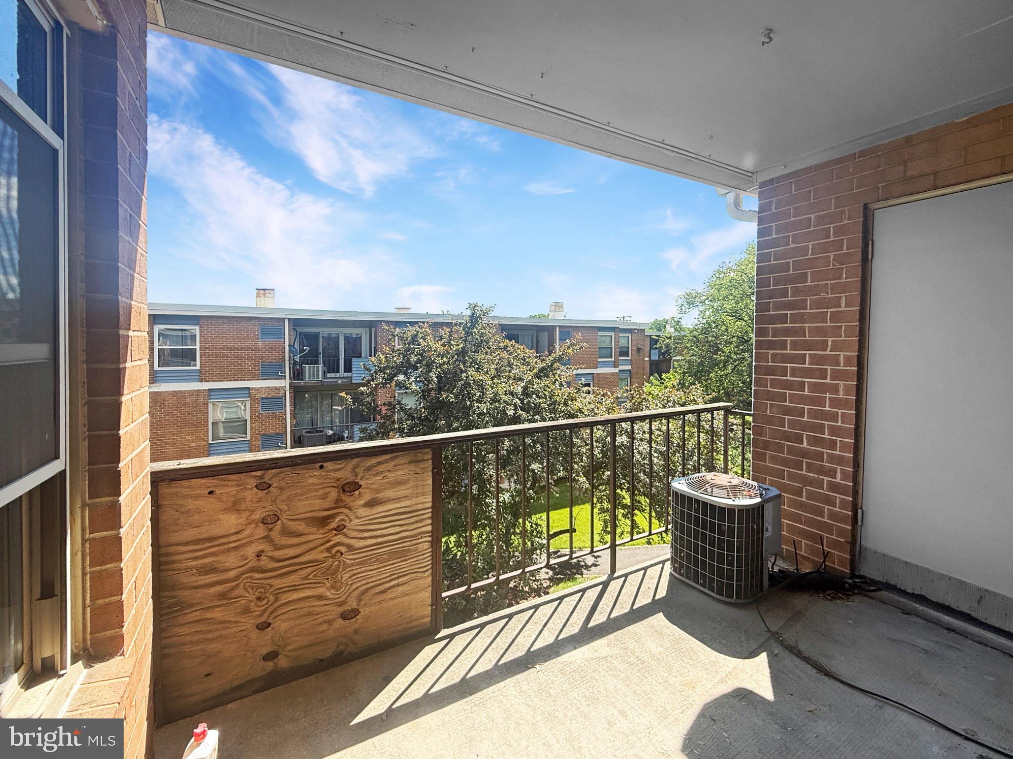 3807 St Barnabas Road, Unit 203 Suitland, MD 20746 - Photo 10 of 23 Sunny balcony with a green view.