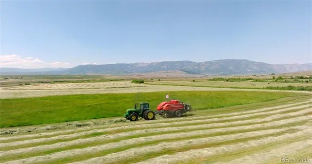 a view of a large mountain with a mountain in the background