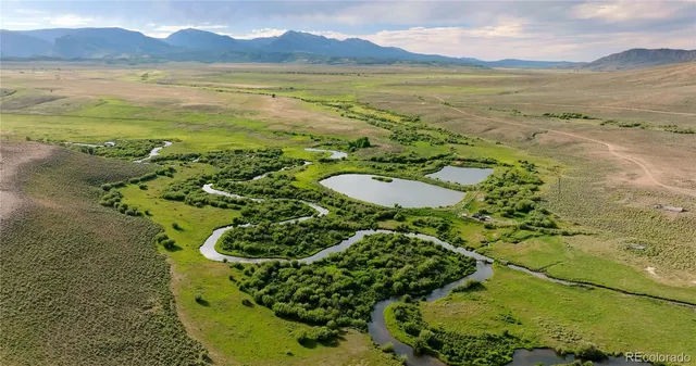 a view of an ocean and a mountain