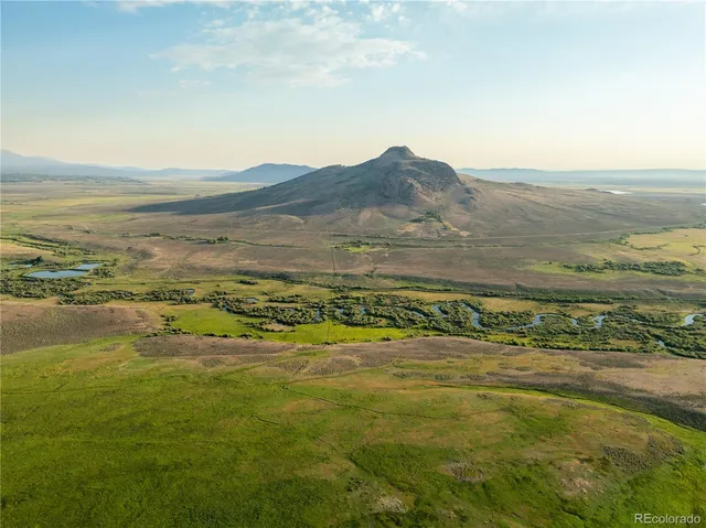 a view of an ocean and a mountain