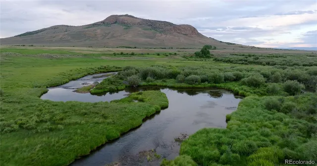 a view of an ocean from a mountain