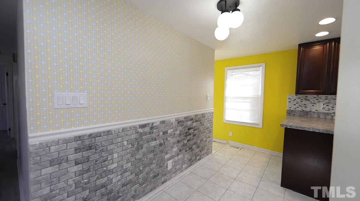 820 Cross Link Road Raleigh, NC 27610 - Photo 4 of 13 a view of livingroom with window