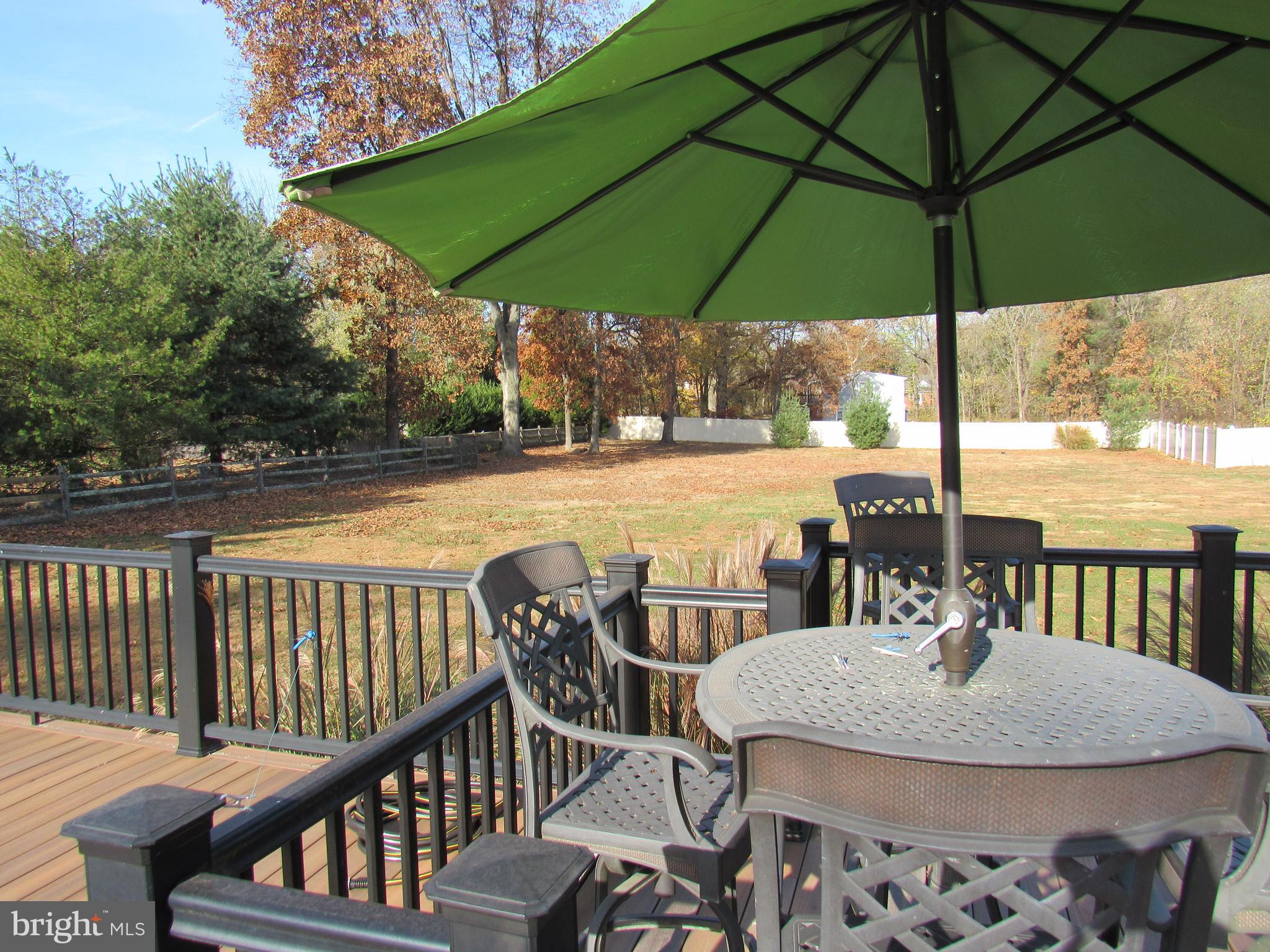 48 Ridge Road Phoenixville, PA 19460 - Photo 13 of 54 a view of a patio with a table chairs and a umbrella
