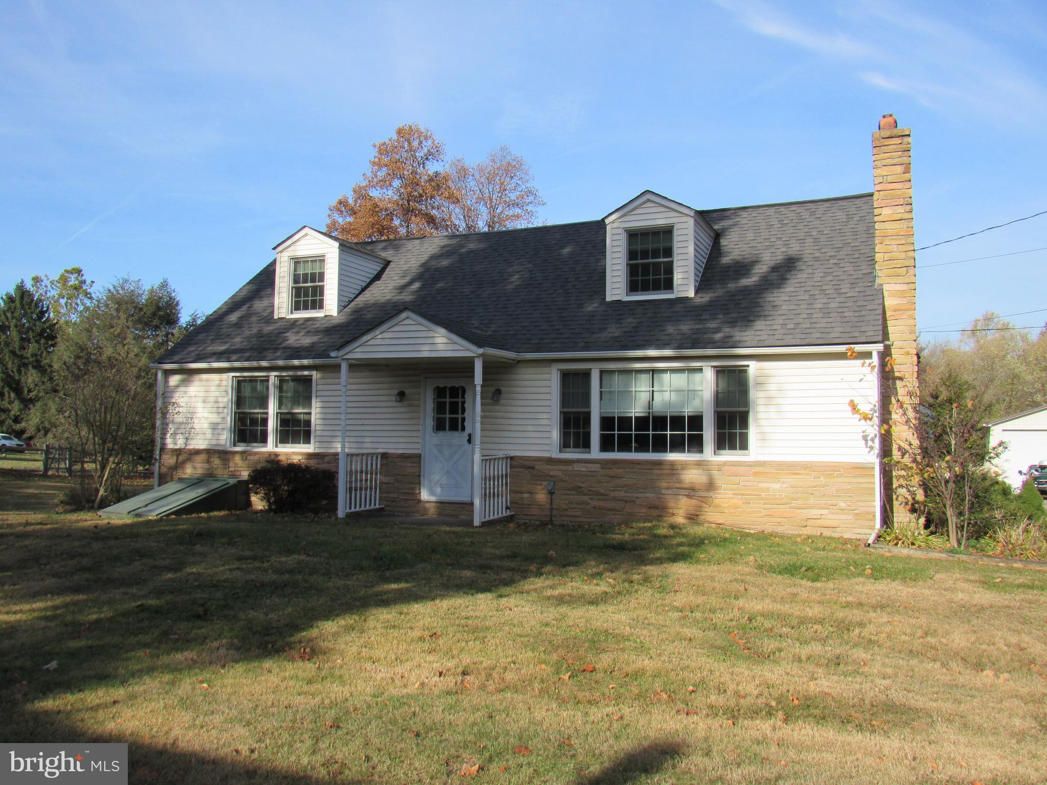 48 Ridge Road Phoenixville, PA 19460 - Photo 4 of 54 a front view of a house with a yard