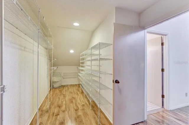 a bedroom with two beds and a dresser