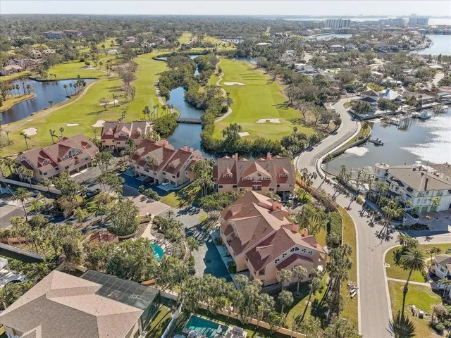 an aerial view of residential building and lake